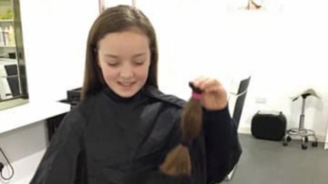 Kind Aimee cuts off her long hair for wig charity